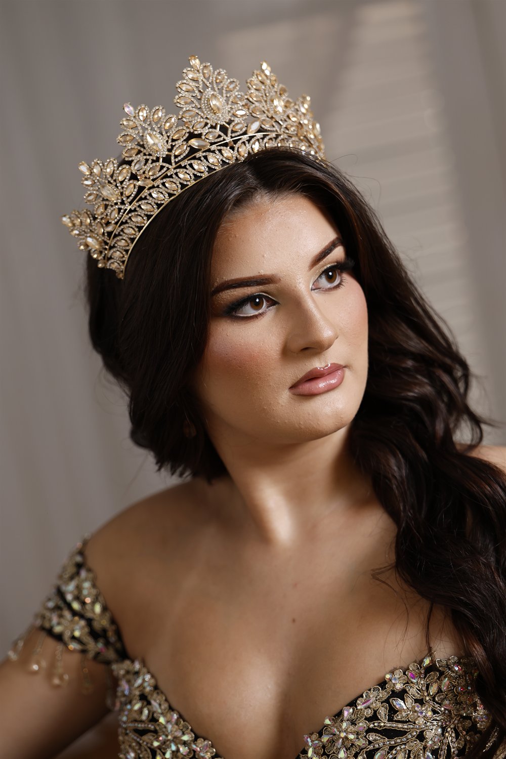 Close-up of Isabella crowned in her quinceañera gown