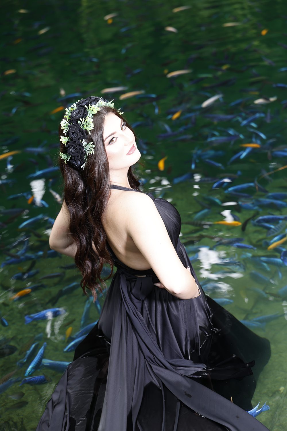 Isabella in a flower crown at a natural spring
