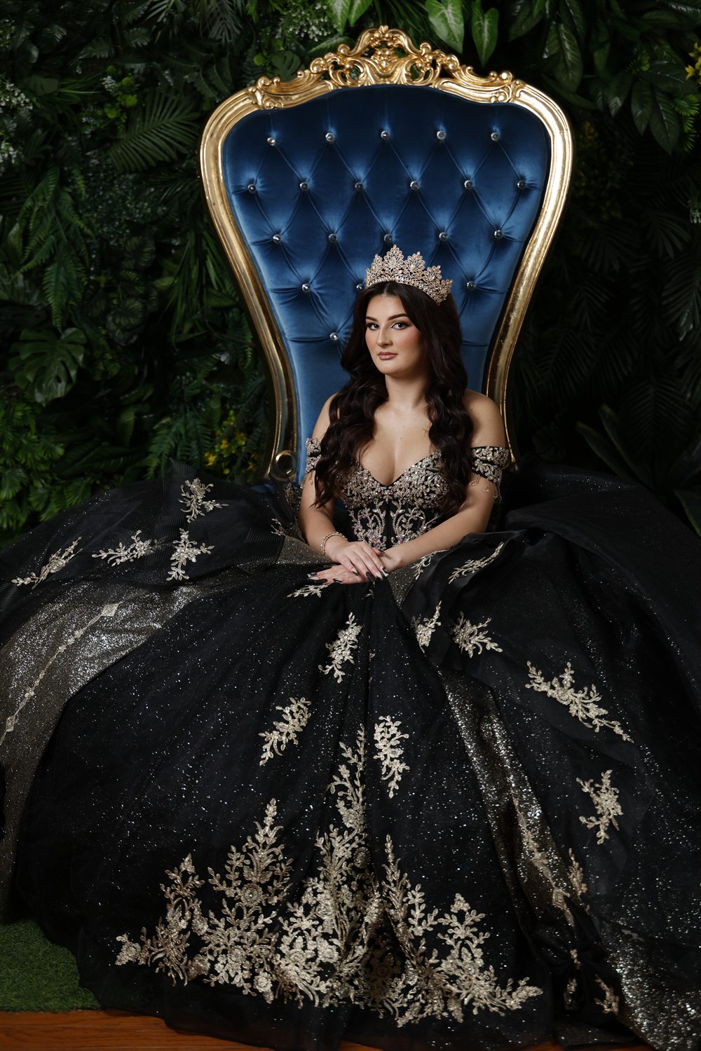 Isabella on a blue-velvet and gold throne